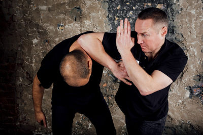 two krav maga fighters fighting at close quarters